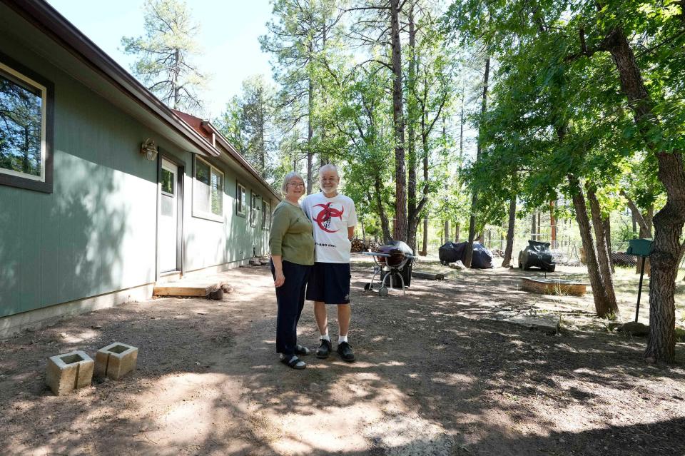 Leslee and Mark Wessel cleared a defensible space between the forest area and their Pinetop-Lakeside back yard.