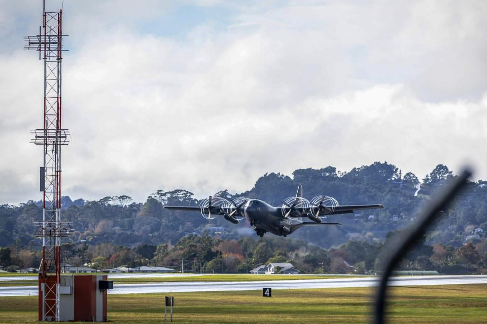 A RNZAF Hercules C-130 takes off from Whenuapai airbase near Auckland, New Zealand, bound for Noumea, New Caledonia, on a mercy mission to rescue stranded New Zealand tourists, Tuesday, May 21, 2024. The Australian and New Zealand governments say they are sending planes to evacuate their nationals from violence-scorched New Caledonia. (Michael Craig/NZ Herald via AP)