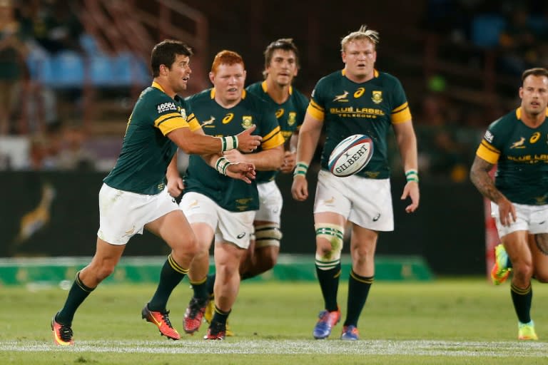 South African Morne Steyn (L) clears the ball during the Castle Lager Rugby Championship International test match between South Africa and Australia at Loftus Versfeld Stadium on October 1, 2016 in Pretoria