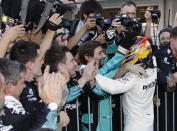 <p>Mercedes driver Lewis Hamilton of Britain is congratulated by his team after winning the Japanese Formula One Grand Prix at Suzuka, Japan, Sunday, Oct. 8, 2017. (AP Photo/Eugene Hoshiko)</p>