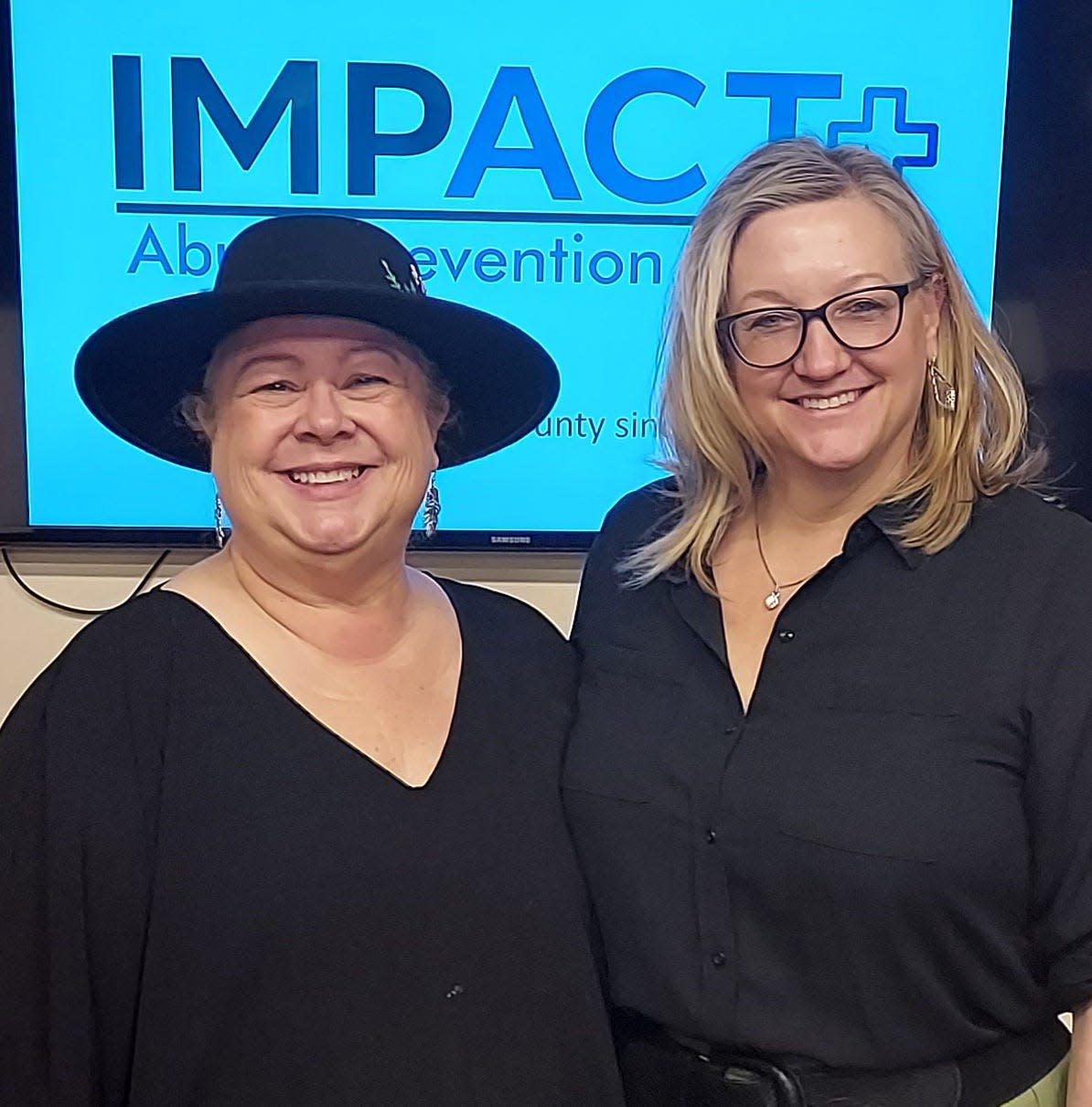 Bea Cote (left), founder of IMPACT+ Abuse Prevention Services, told the Belmont Rotary Club recently about her work to stop domestic violence by helping abusers change their behavior. Hosting the program was Rotarian Kathy Gauger, CEO of Catherine's House in Belmont, which serves homeless women with children.