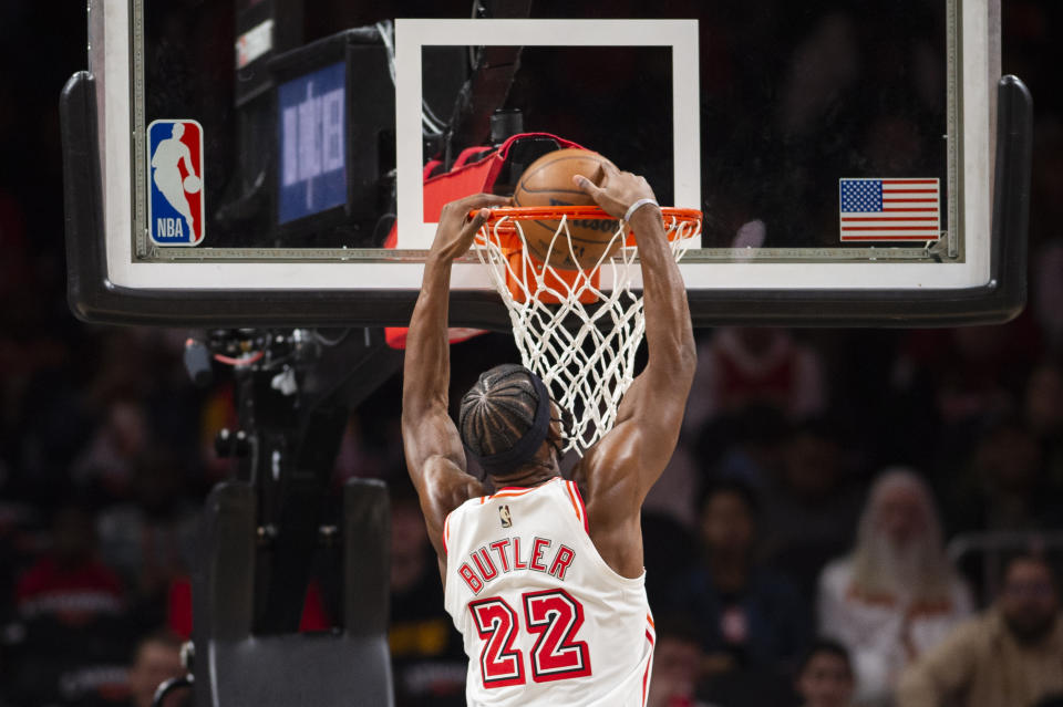 Miami Heat forward Jimmy Butler dunks during the first half of an NBA basketball game against the Atlanta Hawks, Monday, Jan. 16, 2023, in Atlanta. (AP Photo/Hakim Wright Sr.)