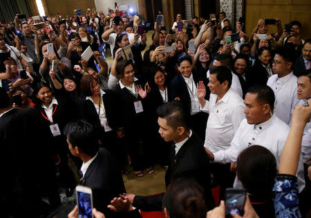 Philippines President Rodrigo Duterte arrives to meet with the Filipino community during his official visit in Kuala Lumpur, Malaysia November 9, 2016. REUTERS/Edgar Su