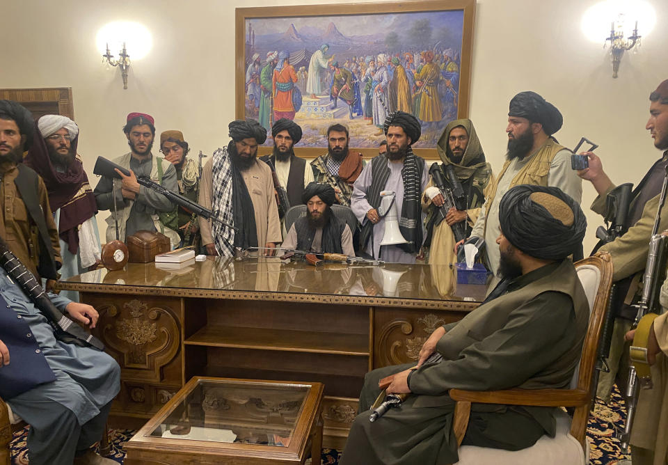 File - Taliban fighters take control of the Afghan presidential palace after Afghan President Ashraf Ghani fled the country, in Kabul, Afghanistan, Sunday, Aug. 15, 2021. (AP Photo/Zabi Karimi, File)