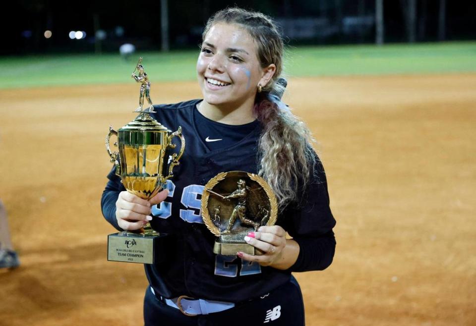 Stephanie Basso holds the championship and MVP trophies after the Coral Springs Charter softball team defeated Western in the BCAA Big 8 softball championship game at Pompano Beach Community Park in Pompano Beach on Thursday, April 27, 2023.