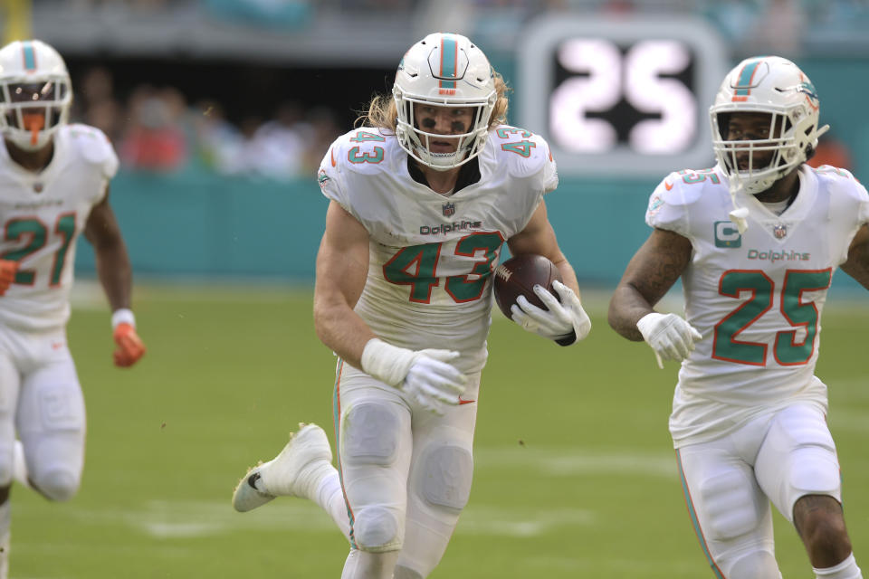 Miami Dolphins linebacker Andrew Van Ginkel (43) runs after intercepting a pass during the first half of an NFL football game against the Houston Texans, Sunday, Nov. 27, 2022, in Miami Gardens, Fla. (AP Photo/Michael Laughlin)