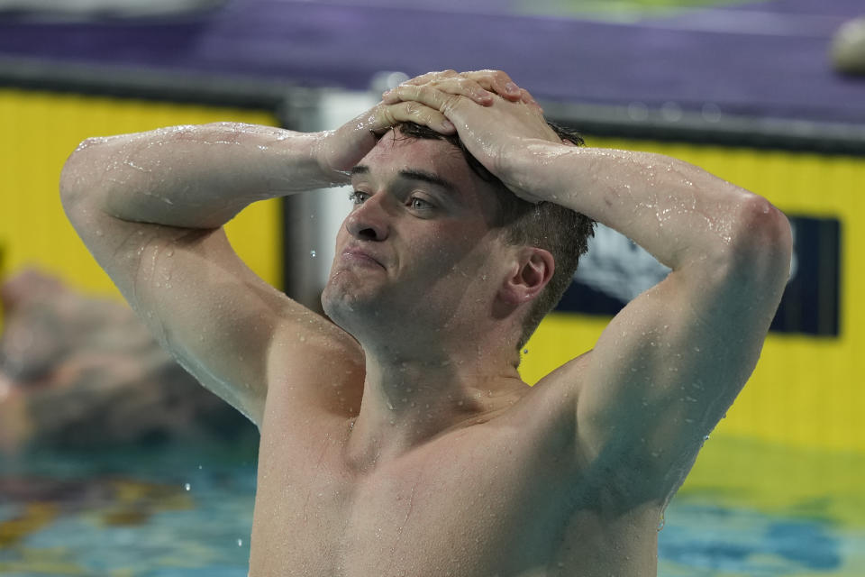 England's James Wilby reacts after winning the Men's 100m Breaststroke final during the swimming at the Commonwealth Games in Sandwell Aquatics Centre in Birmingham, England, Sunday, July 31, 2022. (AP Photo/Aijaz Rahi)