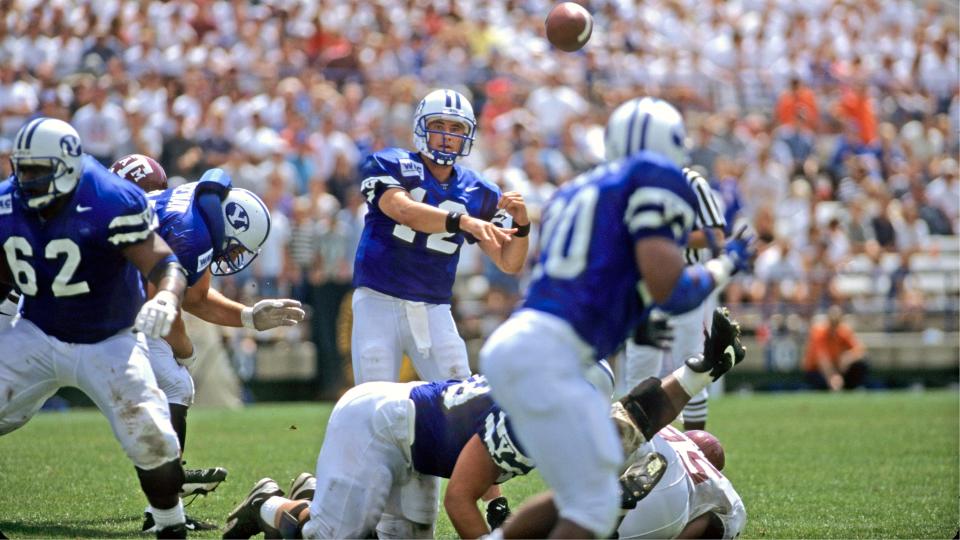 Steve Sarkisian unleashes a pass during the 1996 Pigskin Classic win over No. 13 Texas A&M. Sarkisian passed for 536 yards and six touchdowns that day, leading the Cougars to a 41-37 season-opening upset. "He just had a way," former BYU receiver K.O. Kealaluhi said.