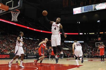 May 3, 2015; Atlanta, GA, USA; Atlanta Hawks forward Paul Millsap (4) grabs a rebound against the Washington Wizards in the first quarter in game one of the second round of the NBA Playoffs. at Philips Arena. Mandatory Credit: Brett Davis-USA TODAY