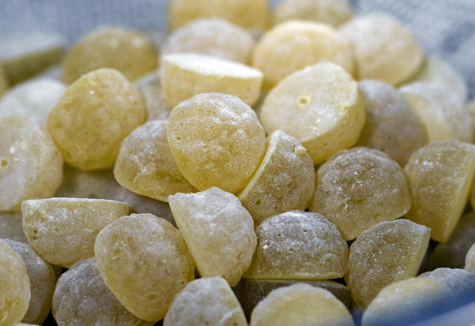 HOLD FOR STORY - This Aug. 22, 2019 photo shows edible Curachews being made from medical marijuana products during a media tour of the Curaleaf medical cannabis cultivation and processing facility in Ravena, N.Y. After legislative efforts stalled and a vaping sickness stirred new concerns, the governors of New York, New Jersey and Connecticut still want to make recreational pot legal. But the states have different approaches and timeframes, and some proposals have shifted since last year. (AP Photo/Hans Pennink)