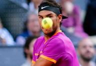 <p>Rafael Nadal of Spain returns the ball to Dominic Thiem of Austria during their ATP Madrid Open final match in Madrid, May 14, 2017. (Photo: Oscar Del Pozo/AFP/Getty Images) </p>