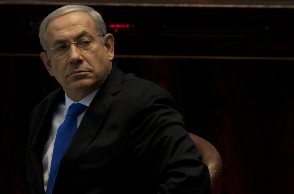 Israeli Prime Minister Benjamin Netanyahu looks on during a session at the Knesset, Israel's parliament in Jerusalem, Monday, Oct. 15, 2012. Israel's parliament has gathered for a vote to dissolve itself and hold early parliamentary elections. (AP Photo/Sebastian Scheiner)