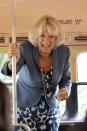 <p>It's not always police escorts and fancy cars. Camilla, Duchess of Cornwall is no stranger to public transportation. Here, she rides the bus for a tour of London's urban gardens. </p>