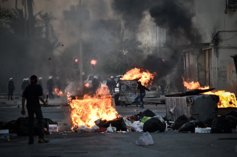 Shiite Bahraini protestors clash with security forces following a rally to mark the second anniversary of an uprising in the Sunni-ruled kingdom of Bahrain in the village of Sanabis, west of the capital Manama on February 14, 2013