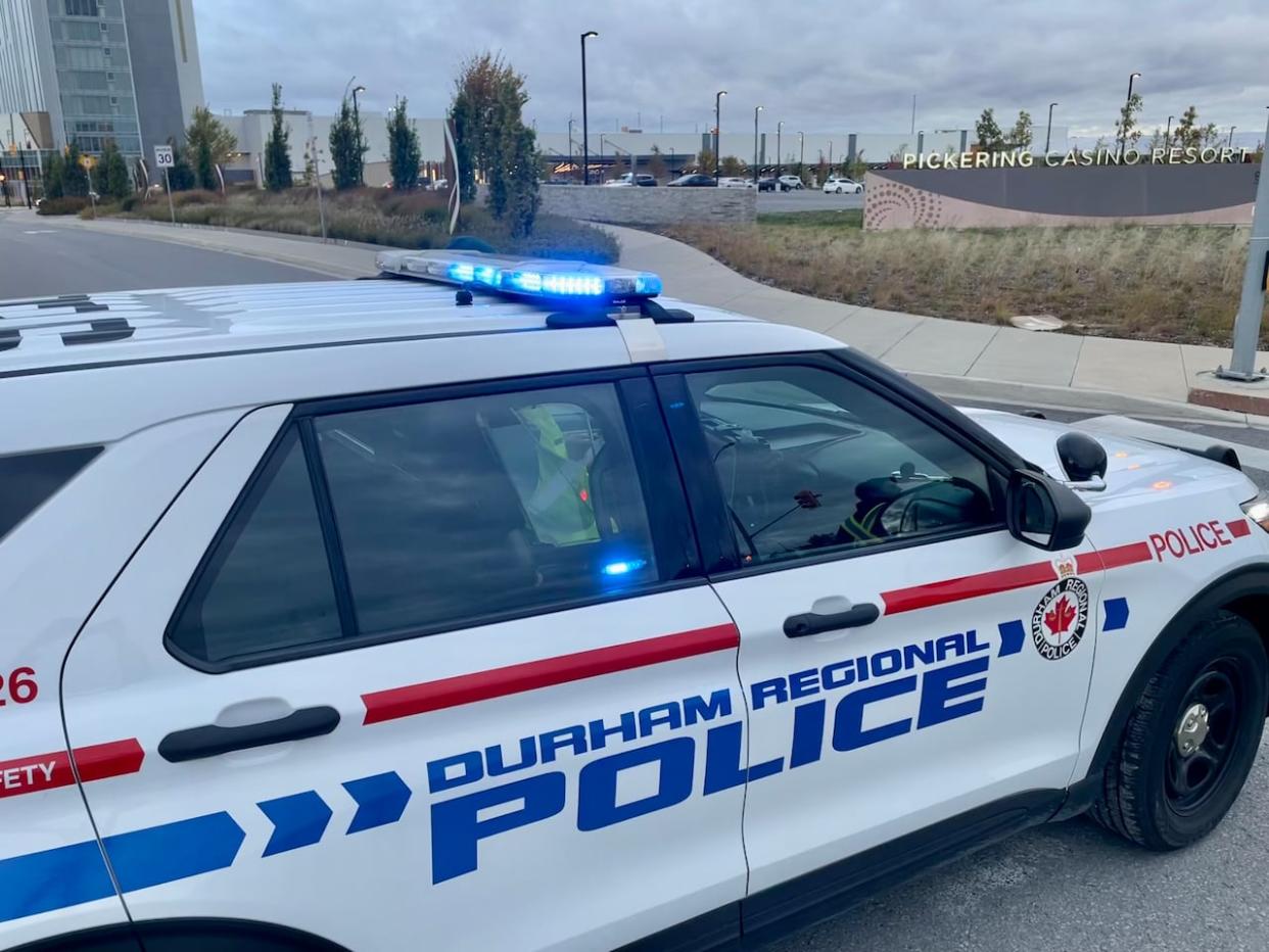 Durham police are searching for a man, 31, who they say is connected to a woman found dead in her Oshawa home Tuesday morning. (Mehrdad Nazarahari/CBC - image credit)