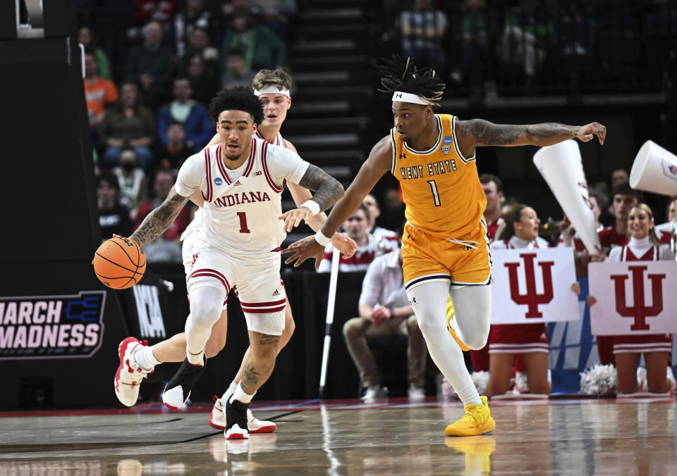 Indiana guard Jalen Hood-Schifino, left, is defended by Kent State forward VonCameron Davis during the first half of a first-round college basketball game in the NCAA Tournament on Friday, March 17, 2023, in Albany, N.Y. (AP Photo/Hans Pennink)