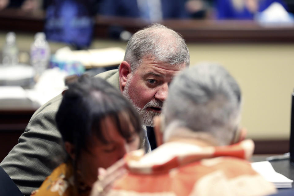 Defense attorney Boyd Young, talks to Frederick Hopkins during his sentencing hearing in Florence, S.C., on Thursday, Oct. 19, 2023. Hopkins was sentenced to life in prison without parole for killing two police officers and wounding five others in an October 2018 ambush at his Florence home (AP Photo/Jeffrey Collins).