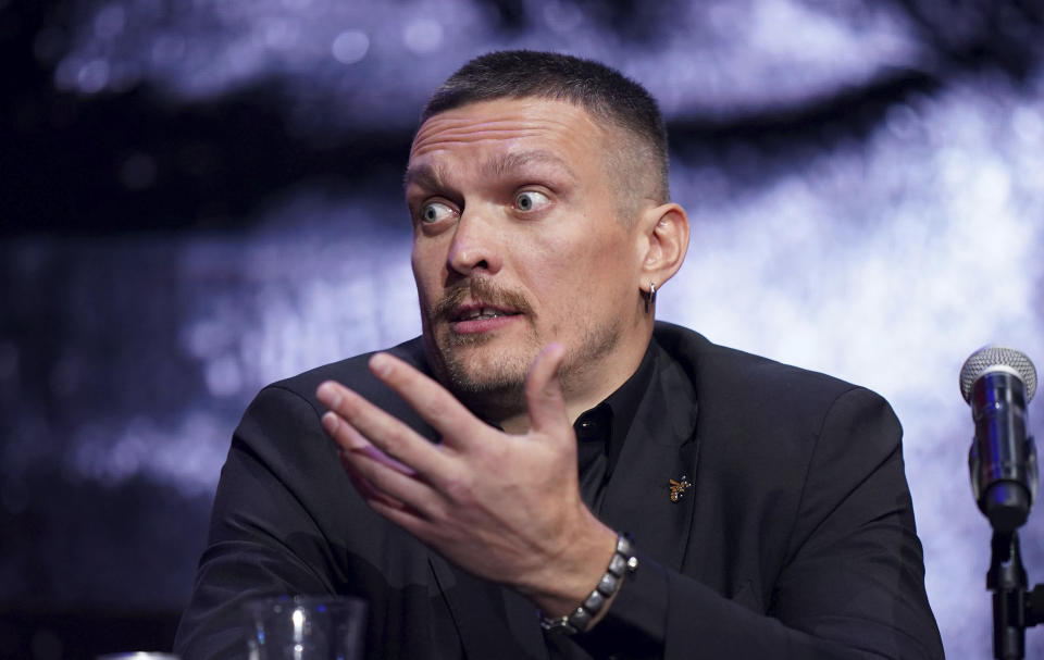 Ukrainian heavyweight boxing champion Oleksandr Usyk reacts during a joint press conference with British WBC and lineal heavyweight champion Tyson Fury, not pictured, at Outernet London, Thursday Nov. 16, 2023. (Zac Goodwin/PA via AP)