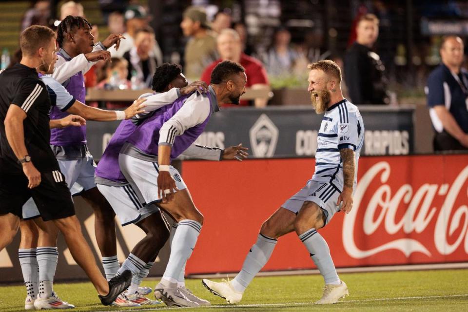 Sporting Kansas City forward Johnny Russell (7) celebrates with teammates after scoring a goal during the second half against the Colorado Rapids at Dick’s Sporting Goods Park on July 4, 2024.