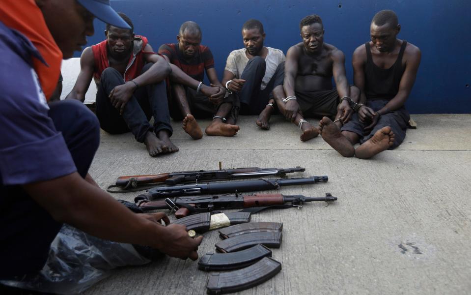 Arrested pirates that hijacked the Panama-flagged Maximus vessel are shown to the media in Lagos, Nigeria - Sunday Alamba /AP