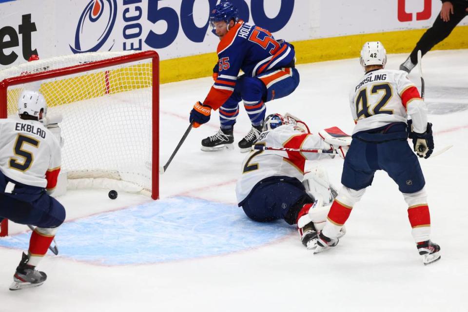 Jun 15, 2024; Edmonton, Alberta, CAN; Edmonton Oilers left wing Dylan Holloway (55) skates passed Florida Panthers goaltender Sergei Bobrovsky (72) in the first period in game four of the 2024 Stanley Cup Final at Rogers Place. Mandatory Credit: Sergei Belski-USA TODAY Sports