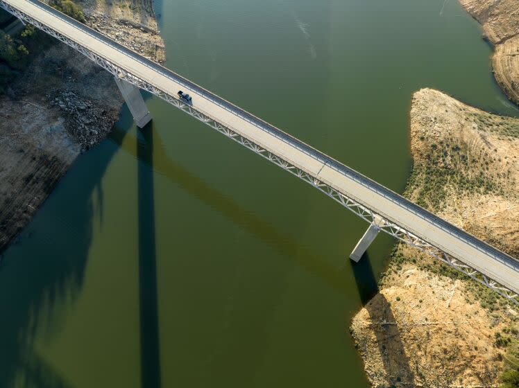 OROVILLE, CA - February 07, 2023: A vehicle crosses the Enterprise Bridge at Lake Oroville on Tuesday February 7, 2023 in Oroville, CA. (Brian van der Brug / Los Angeles Times)