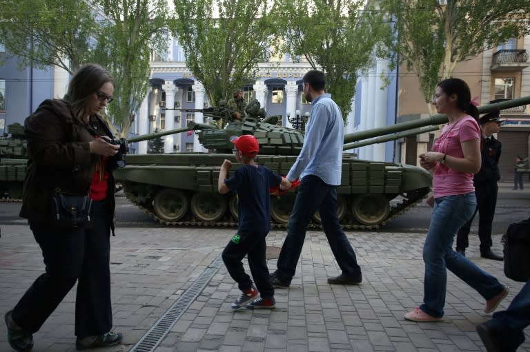 Pro-Russian separatists in Donetsk in eastern Ukraine rehearse with their tanks for a parade