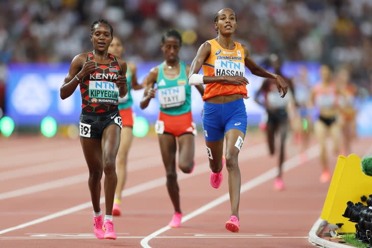 <span class="article__caption">BUDAPEST, HUNGARY – AUGUST 23: Faith Kipyegon of Team Kenya and Sifan Hassan of Team Netherlands compete in the Women’s 5000m Heats during day five of the World Athletics Championships Budapest 2023 at National Athletics Centre on August 23, 2023 in Budapest, Hungary. (Photo by Stephen Pond/Getty Images for World Athletics)</span>