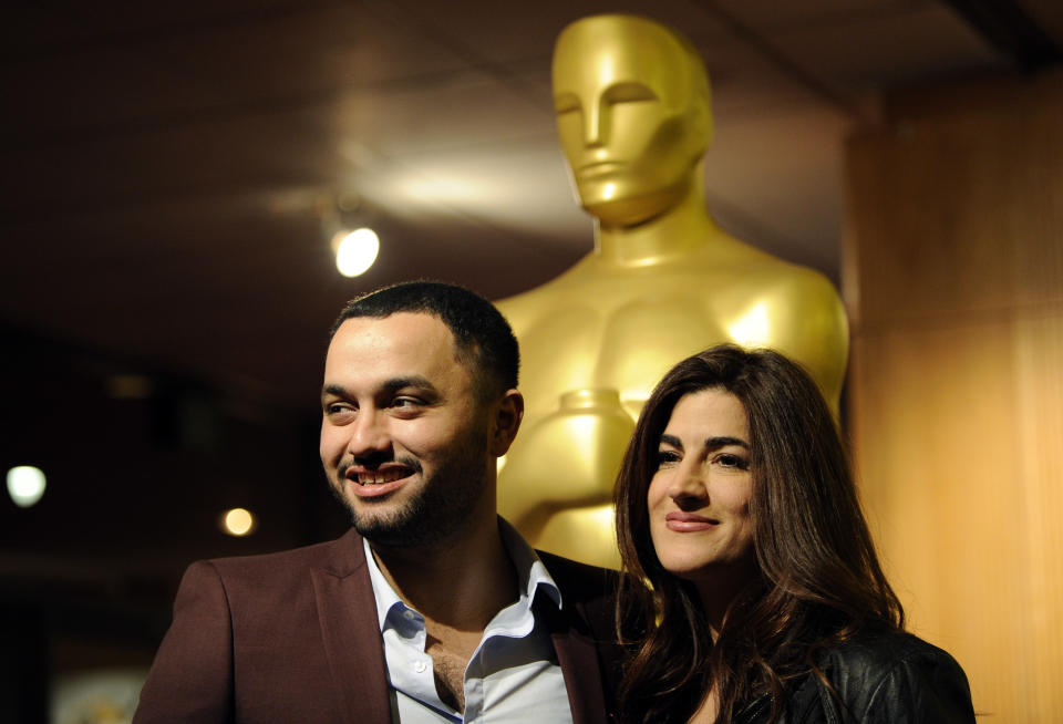Jehane Noujaim, right, director of the Oscar-nominated documentary film "The Square," poses with the film's producer Karim Amer at a reception featuring the Oscar nominees in the Documentary Feature and Documentary Short Subject categories on Wednesday, Feb. 26, 2014, in Beverly Hills, Calif. The Oscars will be held on Sunday at the Dolby Theatre in Los Angeles. (Photo by Chris Pizzello/Invision/AP)