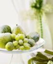 <p>Fake an icy frost with this wintry recipe: Mix three parts white glitter to one part silver. Then coat faux pears, limes and grapes for a sparkly centerpiece.</p><p>See more at <a href="http://www.goodhousekeeping.com/holidays/christmas-ideas/how-to/g2203/christmas-decoration-ideas/" rel="nofollow noopener" target="_blank" data-ylk="slk:Good Housekeeping;elm:context_link;itc:0;sec:content-canvas" class="link ">Good Housekeeping</a>. </p>