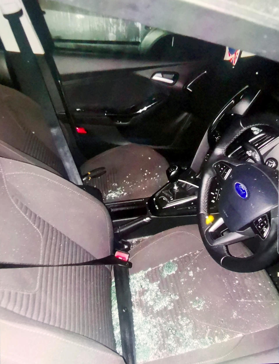 Police couldn't resist poking fun at a thief who locaked himself inside a car he was trying to steal. They had to free him by smashing thew window with a baton. (SWNS)