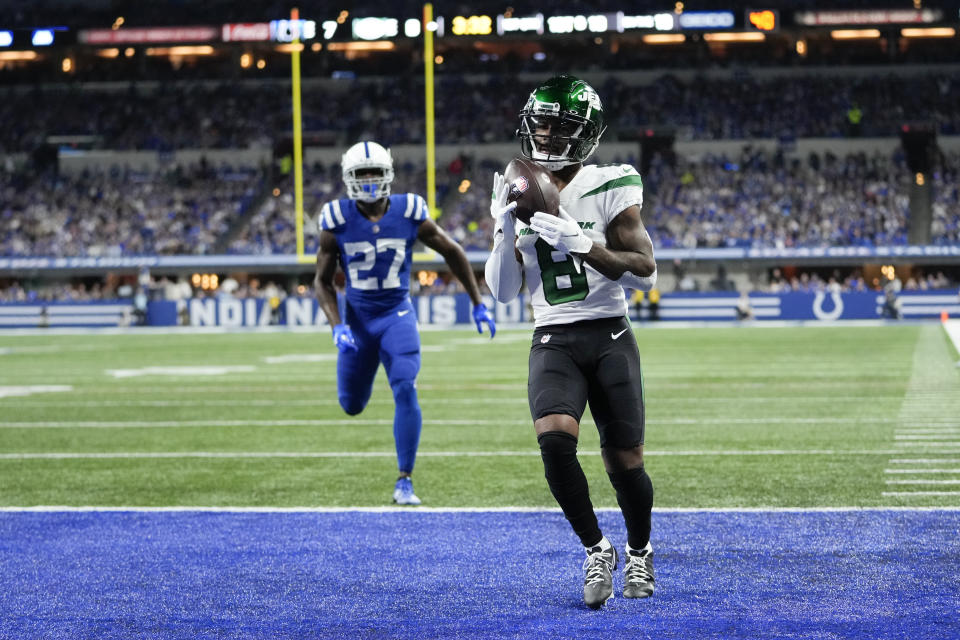 New York Jets' Elijah Moore (8) makes a touchdown reception against Indianapolis Colts' Xavier Rhodes (27) during the first half of an NFL football game, Thursday, Nov. 4, 2021, in Indianapolis. (AP Photo/AJ Mast)