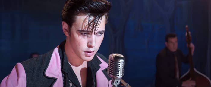 Austin as Elvis singing onstage in a scene from "Elvis"