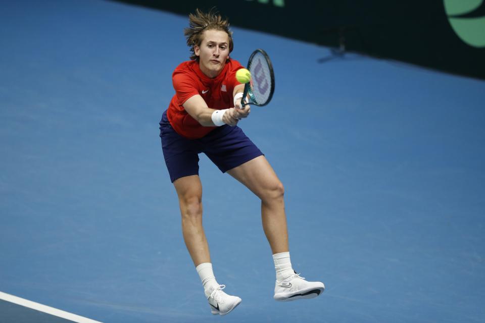 Sebastian Korda of the USA returns the ball to Oleksii Krutykh of Ukraine during a Davis Cup qualifier tennis match between Ukraine and USA in Vilnius, Lithuania, Thursday, Feb. 1, 2024. (AP Photo/Mindaugas Kulbis)