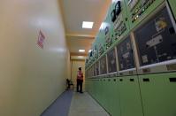 A worker monitors at main control centre at the Benban photovoltaic solar plant in Aswan