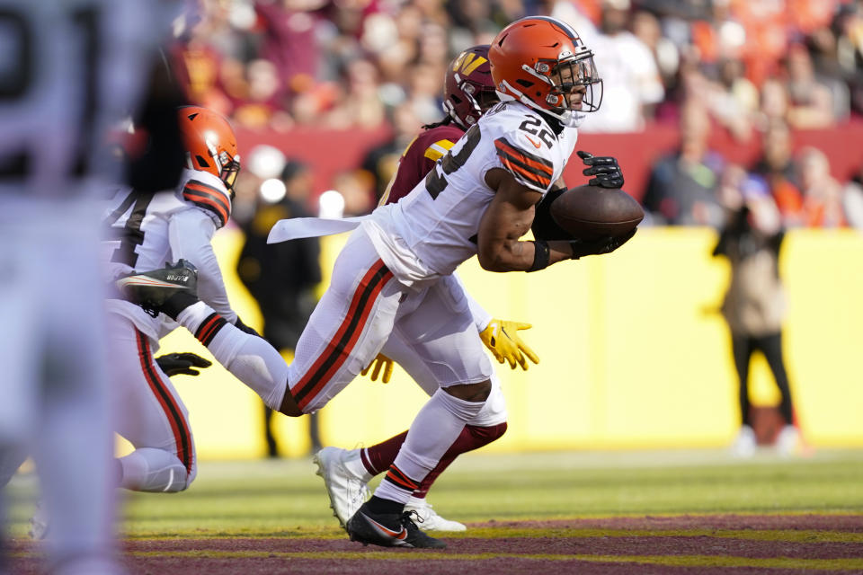 Cleveland Browns safety Grant Delpit (22) intercepts a pass thrown by Washington Commanders quarterback Carson Wentz during the first half of an NFL football game, Sunday, Jan. 1, 2023, in Landover, Md. (AP Photo/Patrick Semansky)