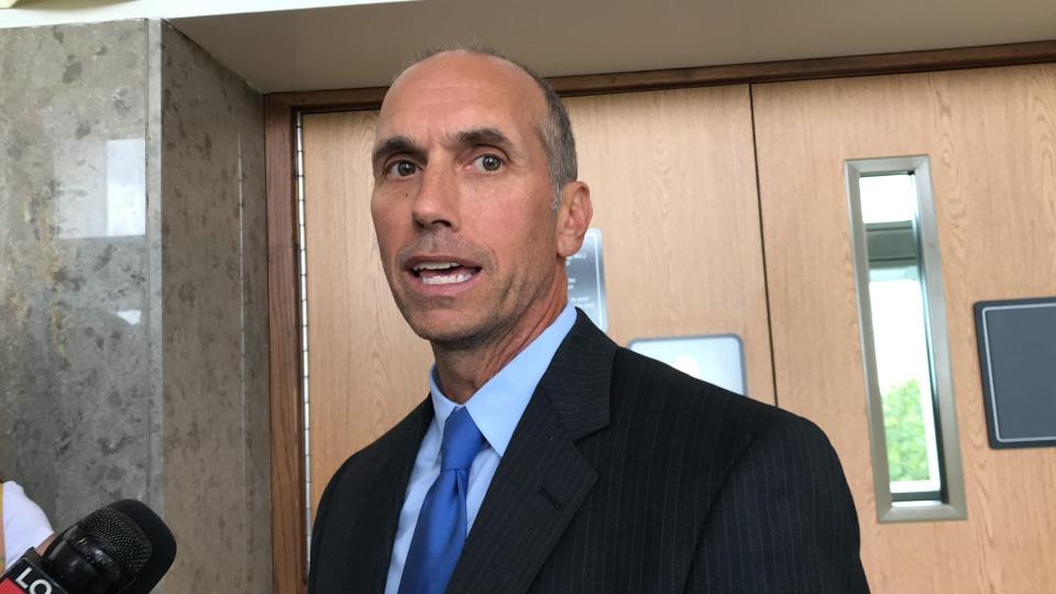 Former Macomb County Prosecutor Eric Smith speaks after his sentencing in an embezzlement probe in a hallway in the Oakland County Circuit Court in Pontiac on Sept. 13, 2023.