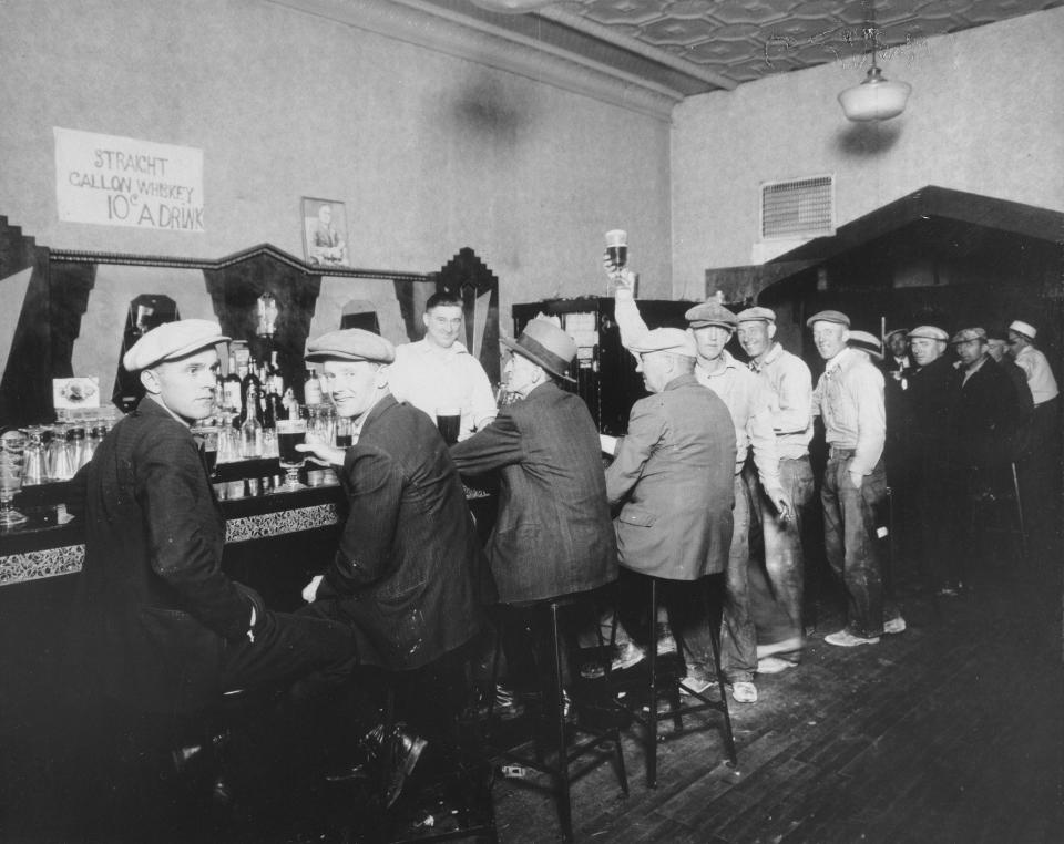 Interior view of Jenning's tavern, located at 5106 South Halsted street, showing a group of men seated and drinking at the bar, Chicago, IL, 1940s. (Photo: Chicago History Museum/Getty Images)