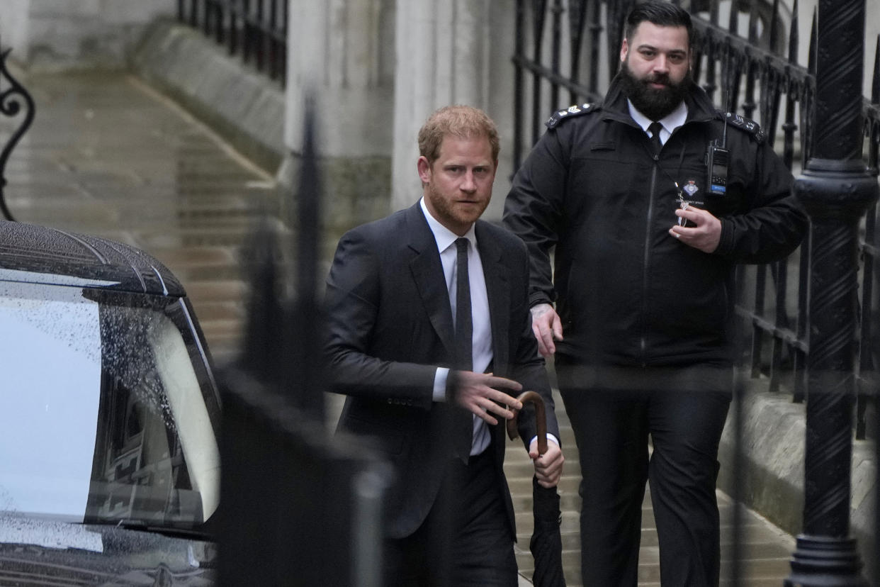 Britain's Prince Harry arrives at the Royal Courts Of Justice in London, Tuesday, March 28, 2023. Prince Harry is in a London court on Tuesday as the lawyer for a group of British tabloids prepared to ask a judge to toss out lawsuits by the prince, Elton John and several other celebrities who allege phone tapping and other invasions of privacy.(AP Photo/Alastair Grant)