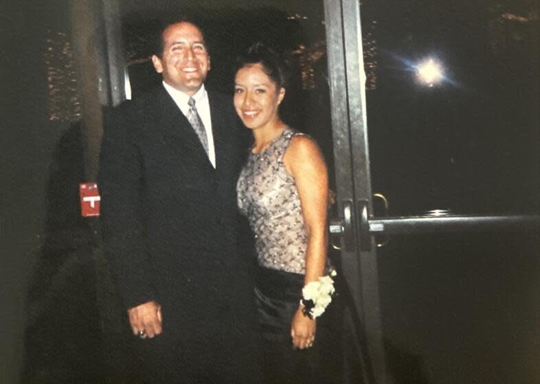 Michael Guzman, left, and Clarissa Vizcaino, right, stand together at Vizcaino's high school prom.