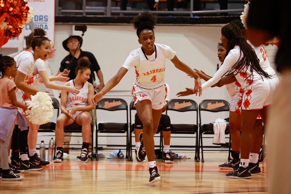 Orange Park's Eris Lester (4) is introduced before a Class 5A regional girls basketball championship against Pine Forest.