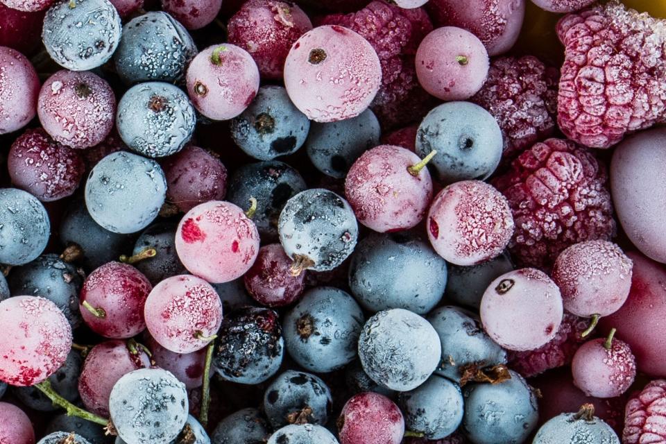 frozen berries, black currant, red currant, raspberry, blueberry. top view. macro