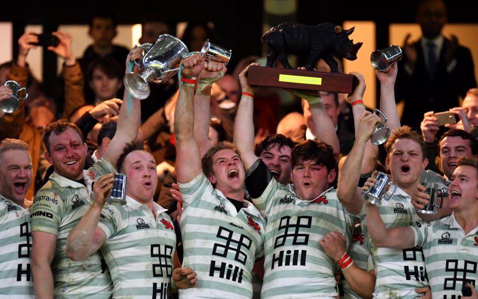 The triumphant Cambridge players lift the trophy - Getty Images Europe
