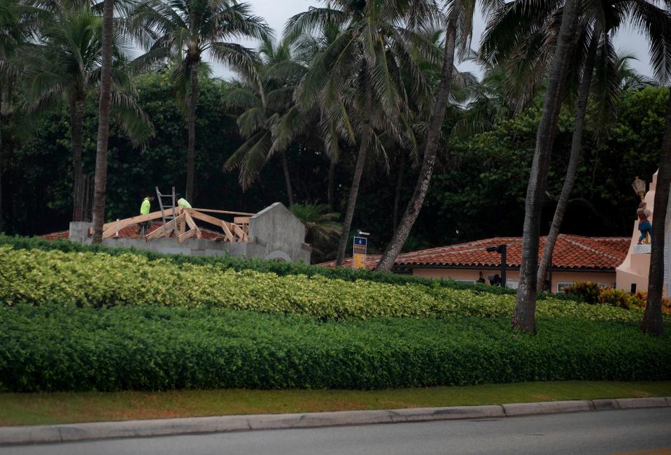 Construction of a new guardhouse for the U.S. Secret Service can be seen beyond the hedges at former President Donald Trump's Mar-a-Lago Club on July 19 in Palm Beach.