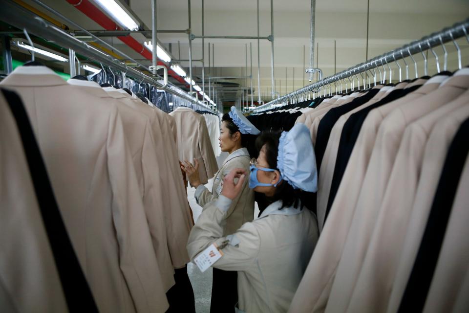 Workers check finished products at the factory of a South Korean-owned company at the jointly-run Kaesong Industrial Complex in Kaesong, North Korea, on Dec. 19, 2013. The Kaesong complex just north of the border is the last remaining inter-Korean rapprochement project.