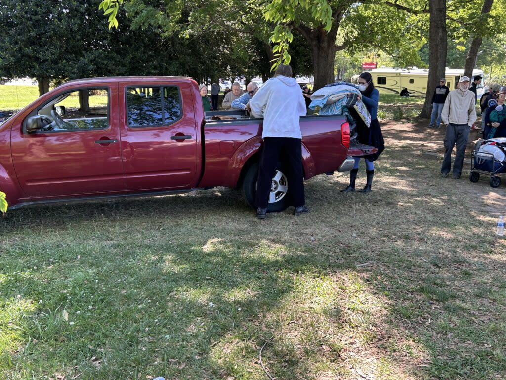 people loading a pickup truck