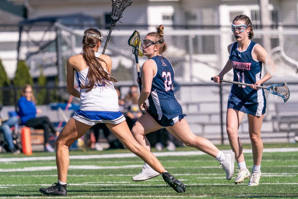 Apponequet's Abby Bradley runs the ball downfield.