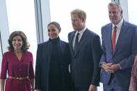 Meghan Markle, second from left, and Prince Harry, second from right, pose for pictures with New York governor Kathy Hochul, left and New York City mayor Bill de Blasio at the observatory in One World Trade in New York, Thursday, Sept. 23, 2021. (AP Photo/Seth Wenig)