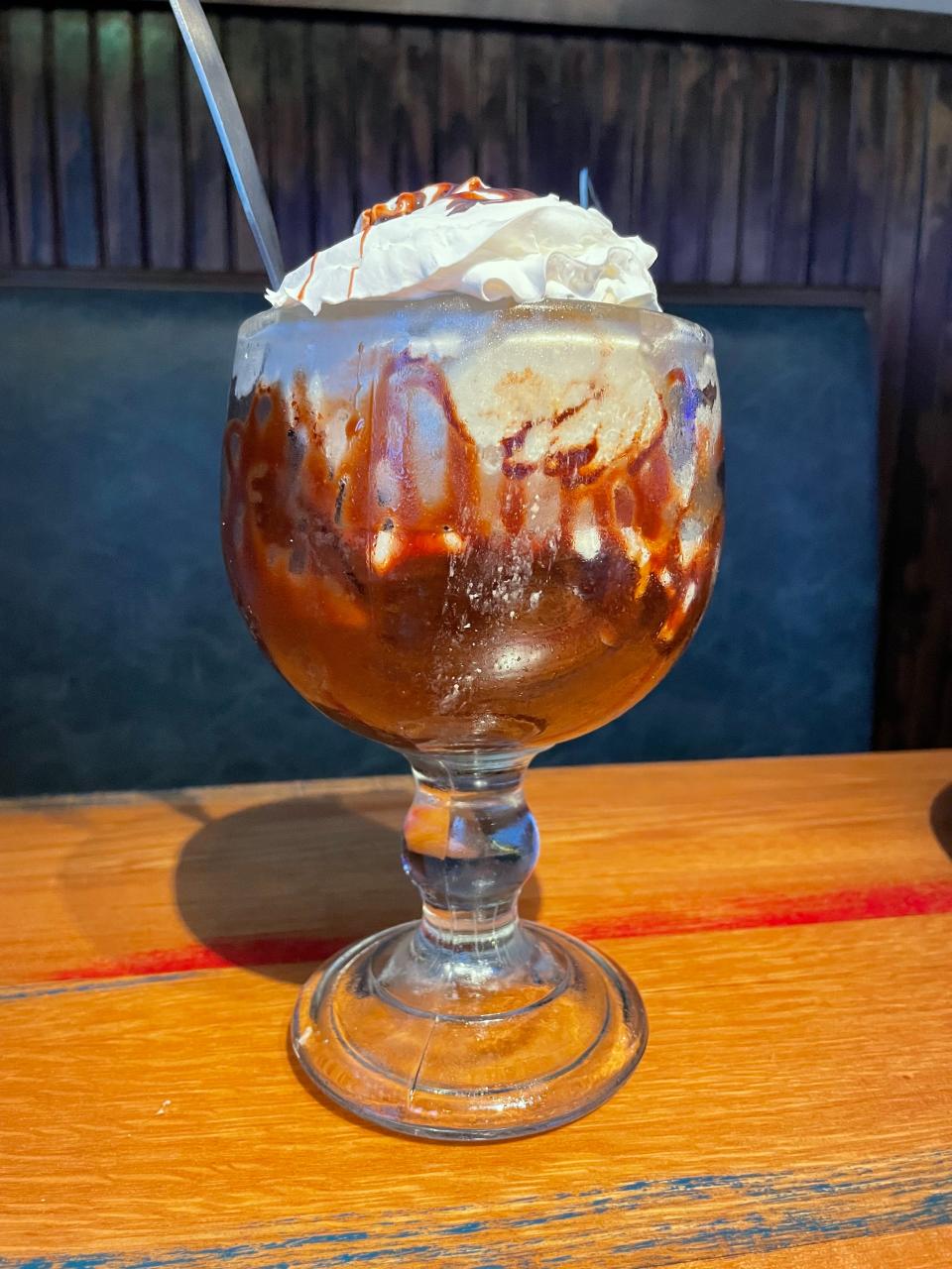 The Brownie Bottom Overload is a fudge brownie served warm and topped with vanilla ice cream and hot fudge served at Blue Moose Burgers & Wings in Alcoa.
