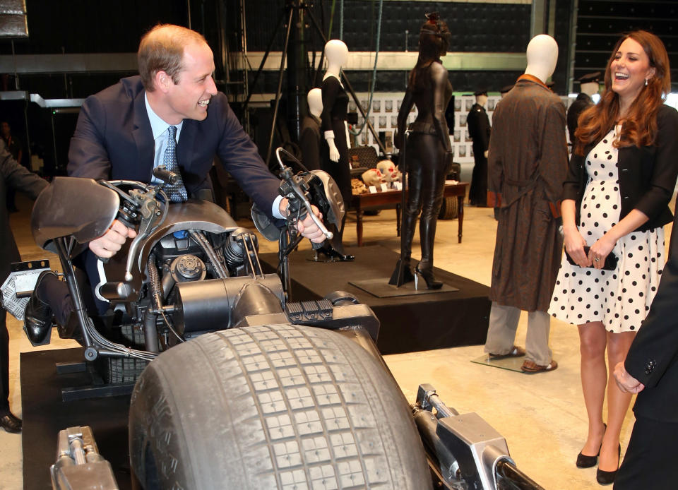 <p>Britain's Kate the Duchess of Cambridge watches her husband Prince William as he sits on the 'Batpod' during the inauguration of "Warner Bros. Studios Leavesden" near Watford, approximately 18 miles north west of central London, Friday, April 26, 2013. As well as attending the inauguration Friday at the former World War II airfield site, the royals will undertake a tour of Warner Bros. "Studio Tour London - The Making of Harry Potter", where they will view props, costumes and models from the Harry Potter film series. (AP Photo/Chris Jackson, Pool)</p>